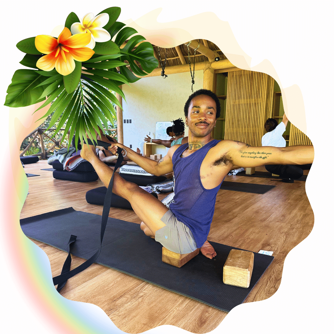 A graphic of a smiling Black trans person practicing Iyengar Yoga on a Yoga Retreat with yoga props. A rainbow and tropical flowers decorate the image. 