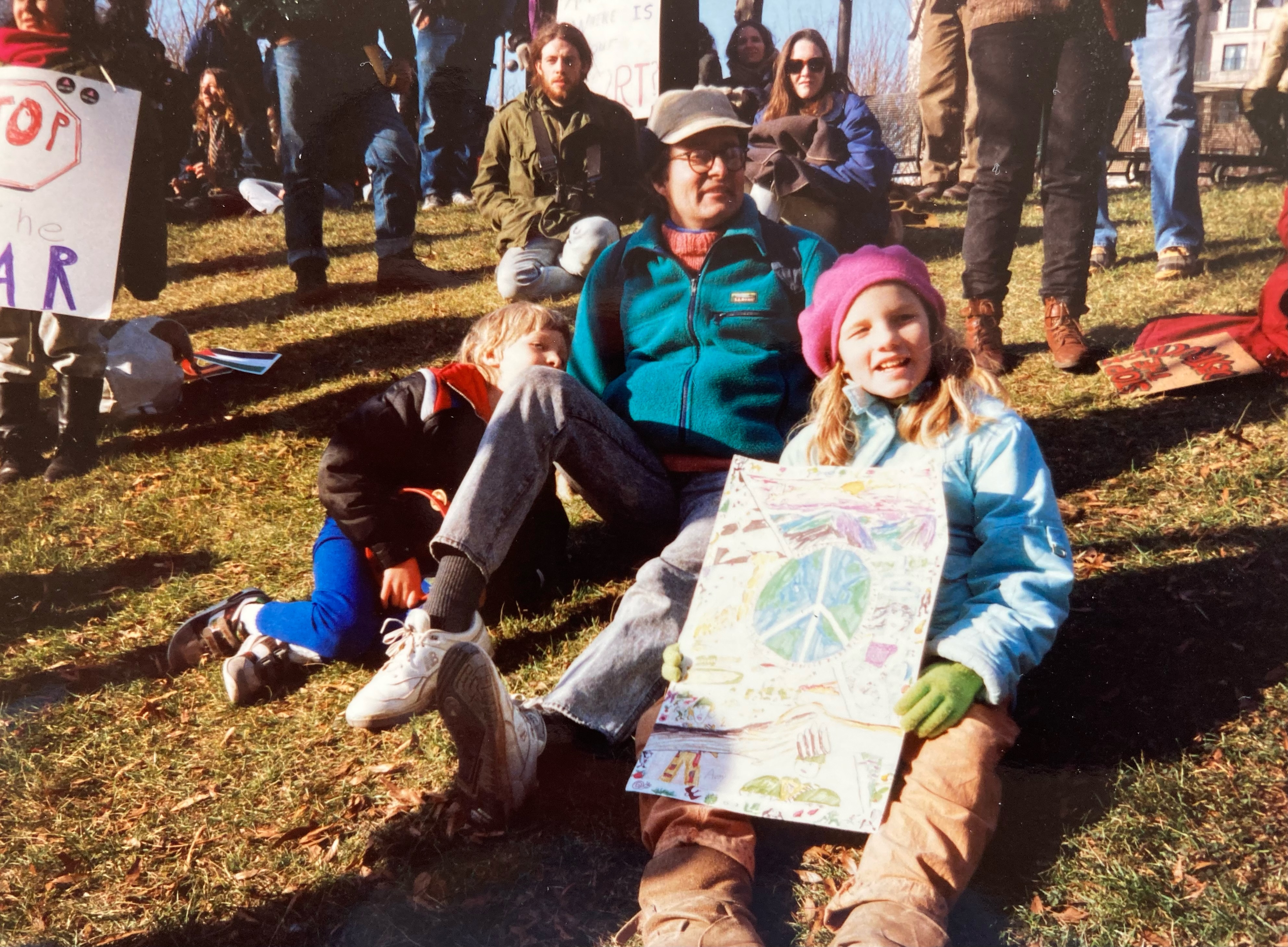 Photo from 1990 of Avery and their family at a "Peace in the Middle East" protest in Washington DC. We drove 5 hours from our home in West Virginia to attend.